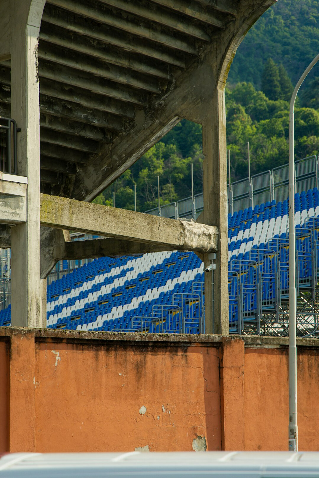 Empty football stadium stands under stadium lights